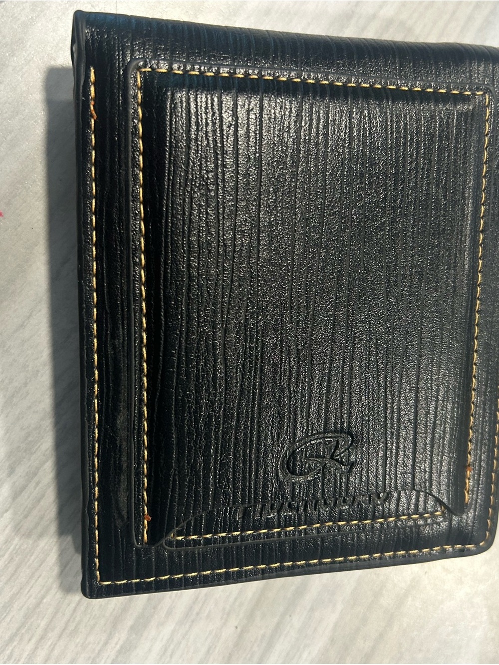 Men's Black Leather Bi-Fold Wallet with Embossed Face and Yellow Eye Accent - Picture 11 of 14